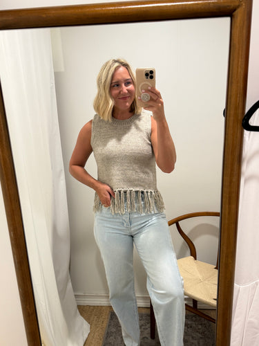Sweater vest featuring fringe bottom